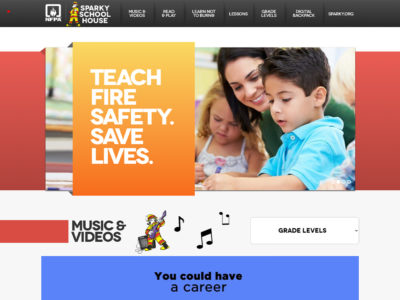 Website screenshot featuring a teacher assisting young children, accompanied by the text "Teach Fire Safety. Save Lives." The site offers resources on fire safety, including lessons, music videos, and grade levels.